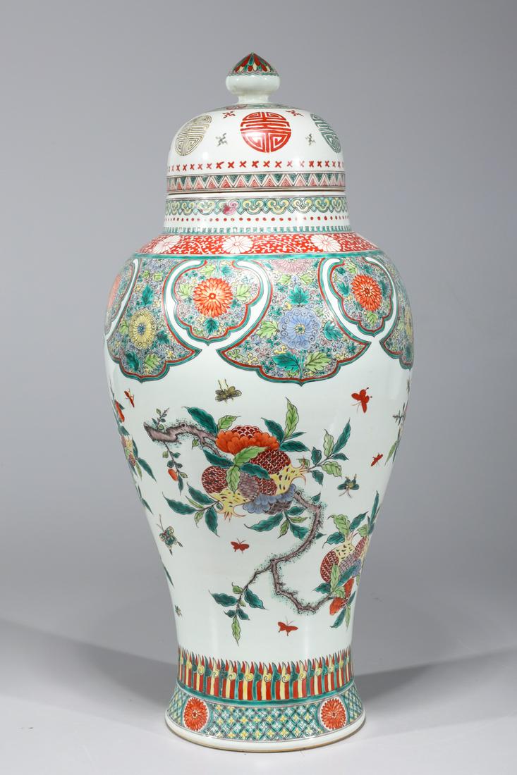 Chinese Famille Verte Enameled Porcelain Vase: Chinese famille verte enameled porcelain vase with allover floral designs, Buddhist marks to cover, and six-character Kangxi mark to base; overall good condition; H 21 1/2" x D 10" (approx.)