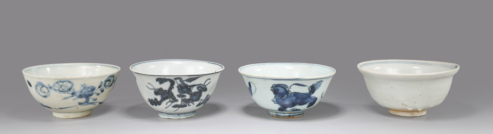 Four Chinese Ming Dynasty Porcelain Bowls: Group of four Chinese Ming Dynasty blue and white porcelain bowls, each with various designs to interior and exterior, one with mark to base; as-is condition with numerous chips, flaws, losses and cra