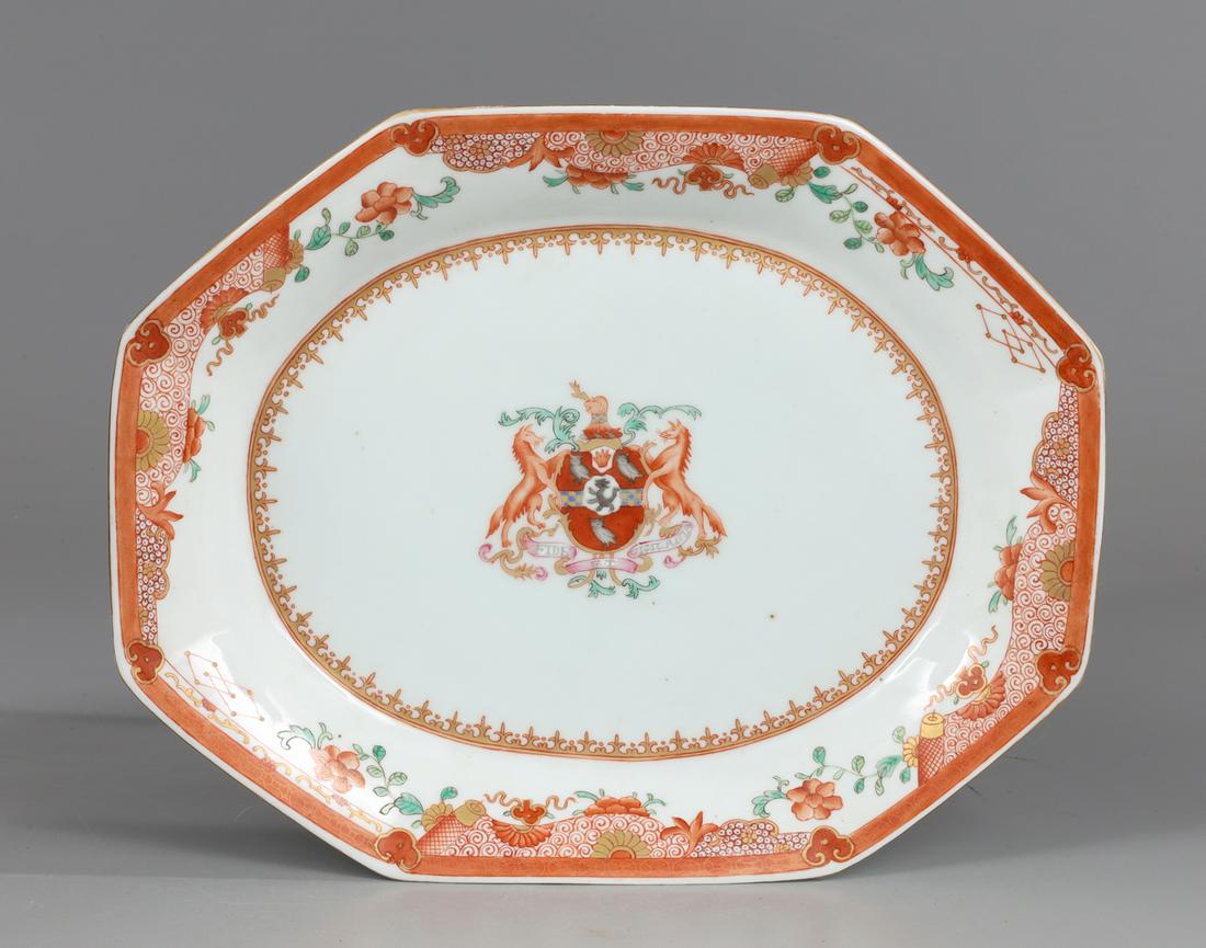 Chinese Red & White Octagonal Porcelain Plate: Chinese red and white octagonal import porcelain plate featuring coat of arms to center; as-is condition with minor wear and flaws; W 12"
