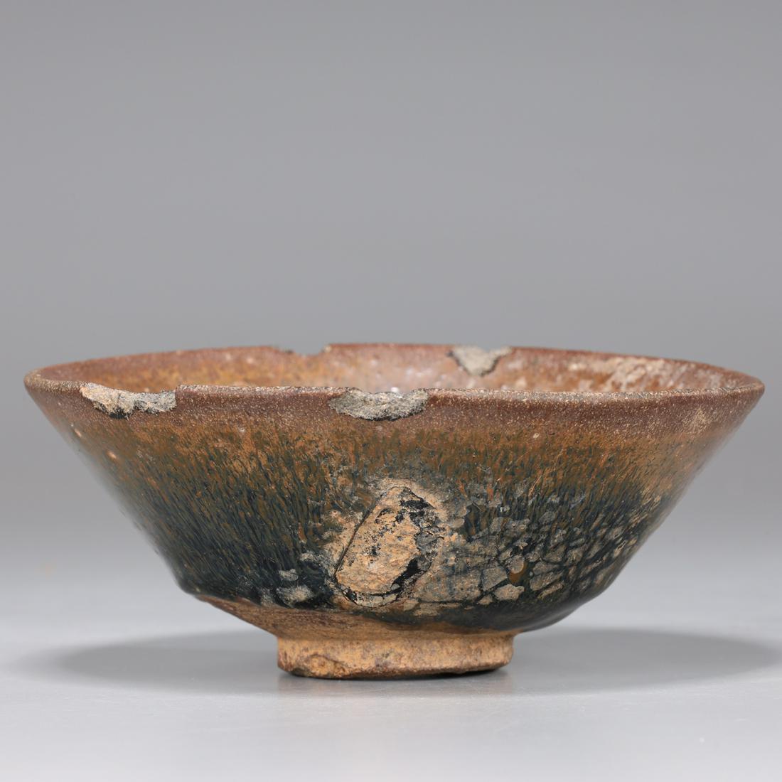 Chinese Song Dynasty Tea Bowl: Chinese Song Dynasty hairs fur tea bowl; as is condition with chips, flaws and losses, possible repairs; W 4 1/4"Provenance: acquired by present owner circa 2002