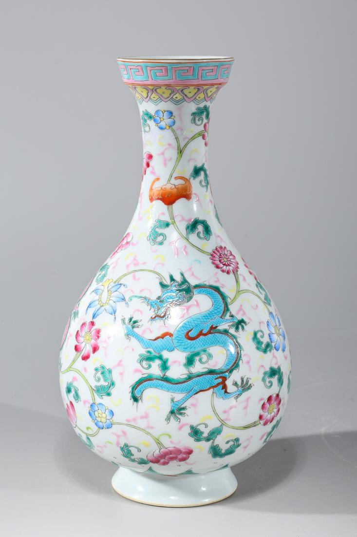 Chinese Famille Rose Enameled Porcelain Vase: Chinese famille rose enameled porcelain vase with dragon designs, six-character Qianlong mark to base; overall good condition; H 10 1/2" x D 5 1/2" (approx.)