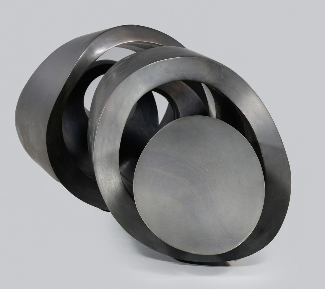 Julie Speidel (b. 1941) Bronze Sculpture: Julie Speidel (b. 1941) bronze abstract sculpture depicting interlocking cylinders; minor surface abrasions, some age wear, overall good condition; L 33" W 12" H 11 1/2" (Approx.)