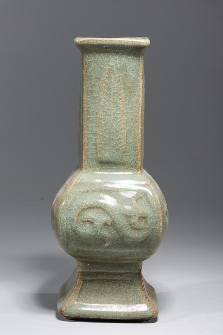 Chinese Celadon Glazed Porcelain Vase: Chinese celadon glazed porcelain vase with molded designs to body; overall good condition, minor wear; H 9 3/8" x W 4" x L 4" (approx.)Provenance: Private Florida, USA Collection