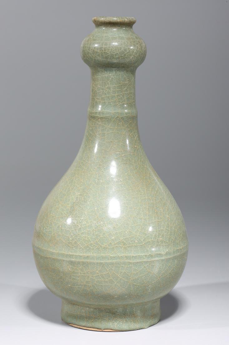 Chinese Celadon Glazed Garlic Mouth Vase: Chinese celadon glazed garlic mouth vase; overall good condition; H 9 1/4" x D 4 7/8" (approx.)Provenance: Private Florida, USA Collection