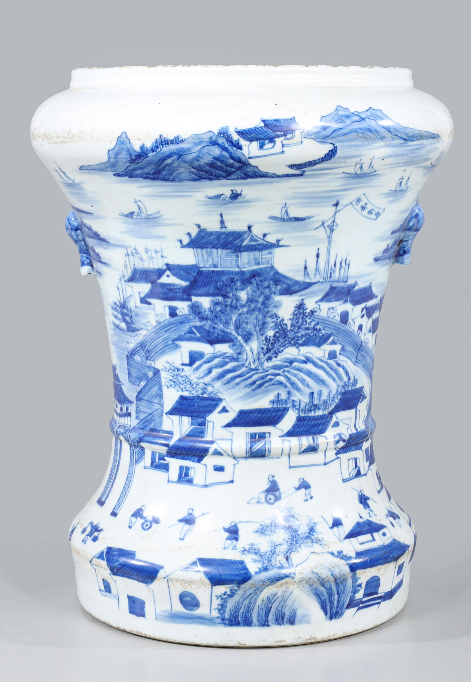 Large Chinese Blue & White Porcelain Beaker Vase: Large Chinese blue and white porcelain beaker vase, the wide foot supporting a tapered body terminating in a wide shoulder and mouth, the design to the body a village and river scene with numerous fig