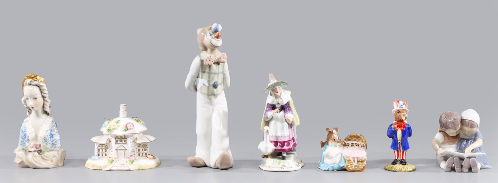 Group of Seven Vintage Fine Porcelain Figures, Meissen, Coalport, Beswick: Group of seven vintage fine porcelain figures, including; Royal Doulton Uncle Sam Bunnykins; Beswick "Hunca Munca"; B & G Denmark reading children; Coalport Parasol House; Meissen old mother goose; Ca