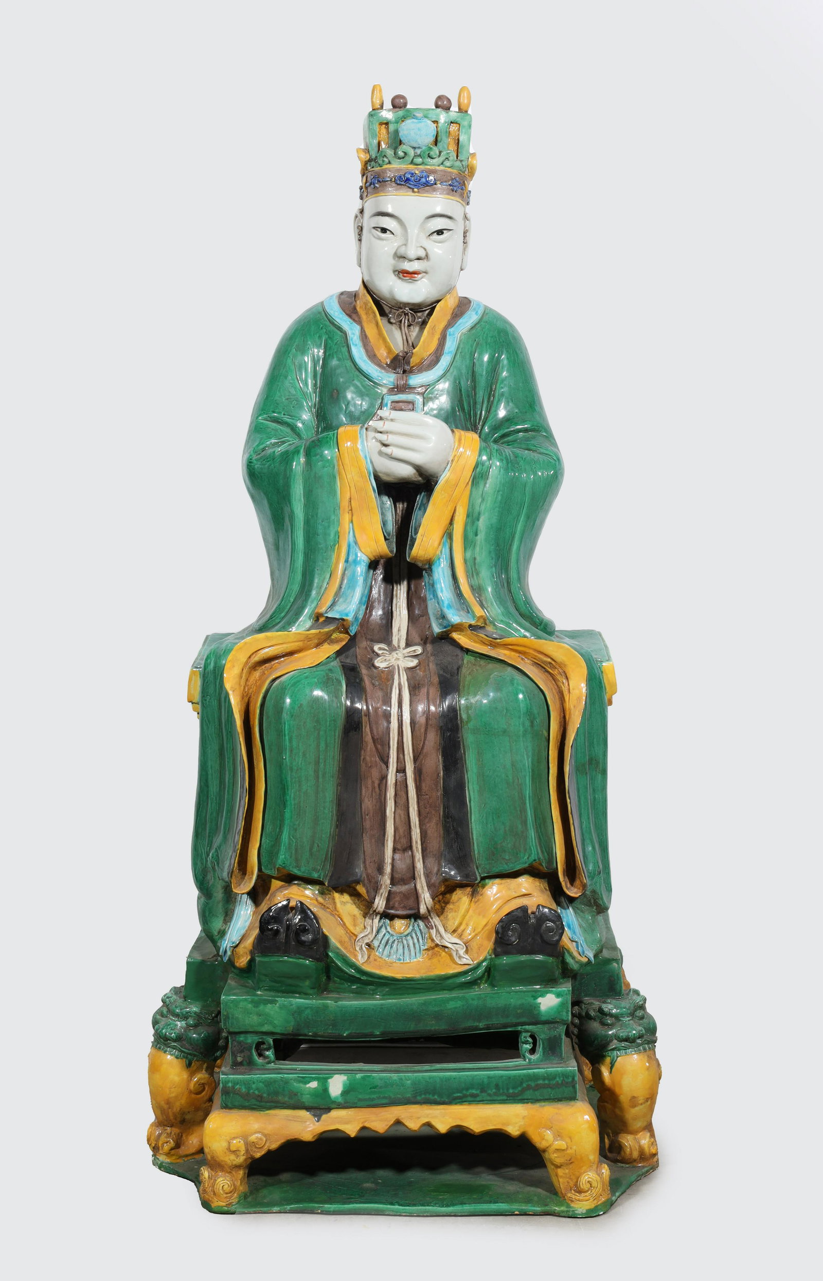 Large Chinese Sitting Figure: Large Chinese sitting ceramic figure in green robes with folded hands; as is condition, age wear, surface wear, surface soiling; L 18 3/4" W 14" H 46 1/2" (Approx.)