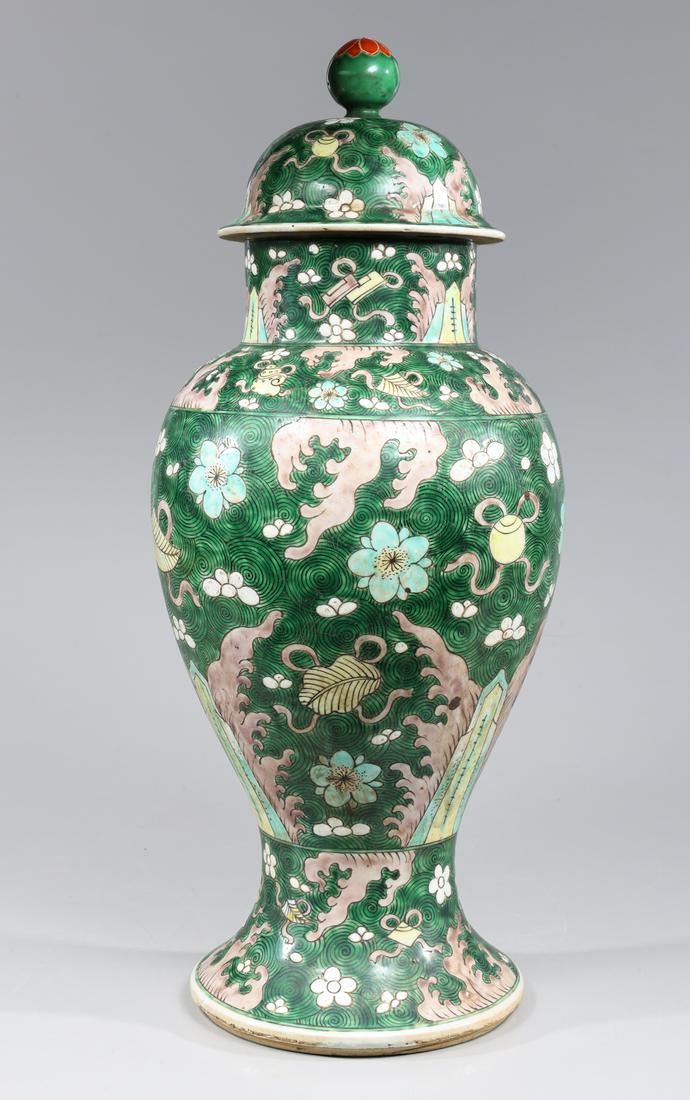 Chinese Famille Verte Glazed Porcelain Covered Vase: Chinese Famille Verte glazed enameled porcelain covered vase the green ground with repeating geometric circles and enameled Buddhist emblems throughout amidst flowers and waves, cover similarly decora