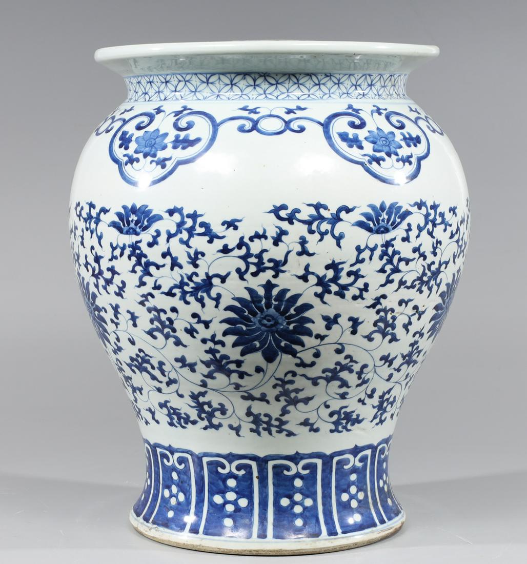 Large Chinese Blue & White Porcelain Garden Seat: Large Chinese blue and white porcelain garden seat with allover designs of lotus flowers, vines and tendrils; H 16"