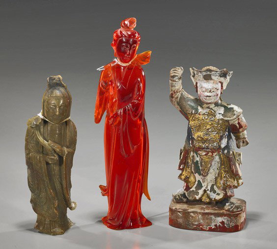 Group of Three Chinese Figures: Group of Three Chinese Figures Three Chinese figures: carved soapstone Guanyin carrying a ruyi scepter (scuffing); amberine Guanyin (losses, repair to head); together with an antique lacquered and gil