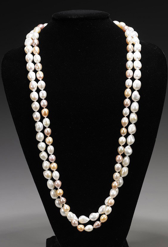 Two Strands of Baroque Cultured Pearls: Two Strands of Baroque Cultured Pearls Two strands of Baroque (fresh water) cultured pearls: one comprised of silvery white pearls; together with a multi-color white gold and gray strand; L: 32" (long