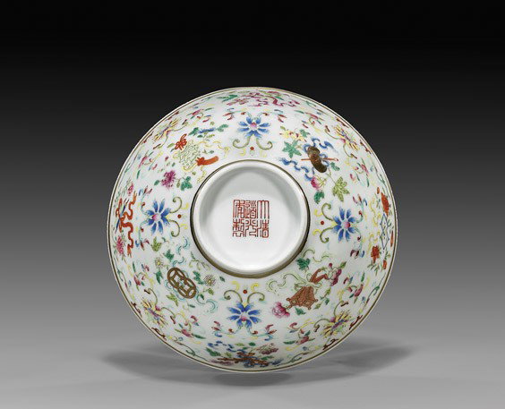 DAOGUANG-STYLE PORCELAIN BOWL: DAOGUANG-STYLE PORCELAIN BOWL Chinese Daoguang-style porcelain bowl: with blue and white lingzhi and flower motifs to the interior; the Famille Rose enameled exterior with Buddhist Emblems alternating