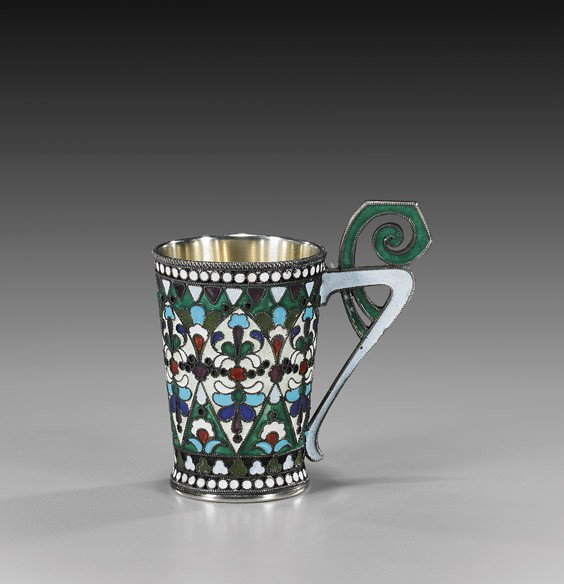 ANTIQUE RUSSIAN ENAMELED SILVER CUP: ANTIQUE RUSSIAN ENAMELED SILVER CUP Small antique Russian enameled silver cup; of slightly flared form with ornate handle, decorated in stylized floral lappets, hallmarked 84 Standard, signed; H: 2 1/