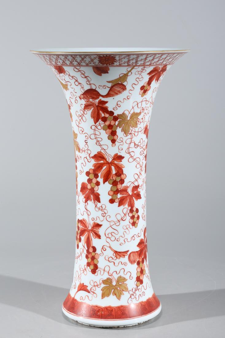 Chinese Red & Gilt Porcelain Beaker Vase: Chinese red and gilt enameled porcelain beaker vase with grapes and squirrels to body; overall good condition; H 14 1/4" x D 8 1/4" (approx.)