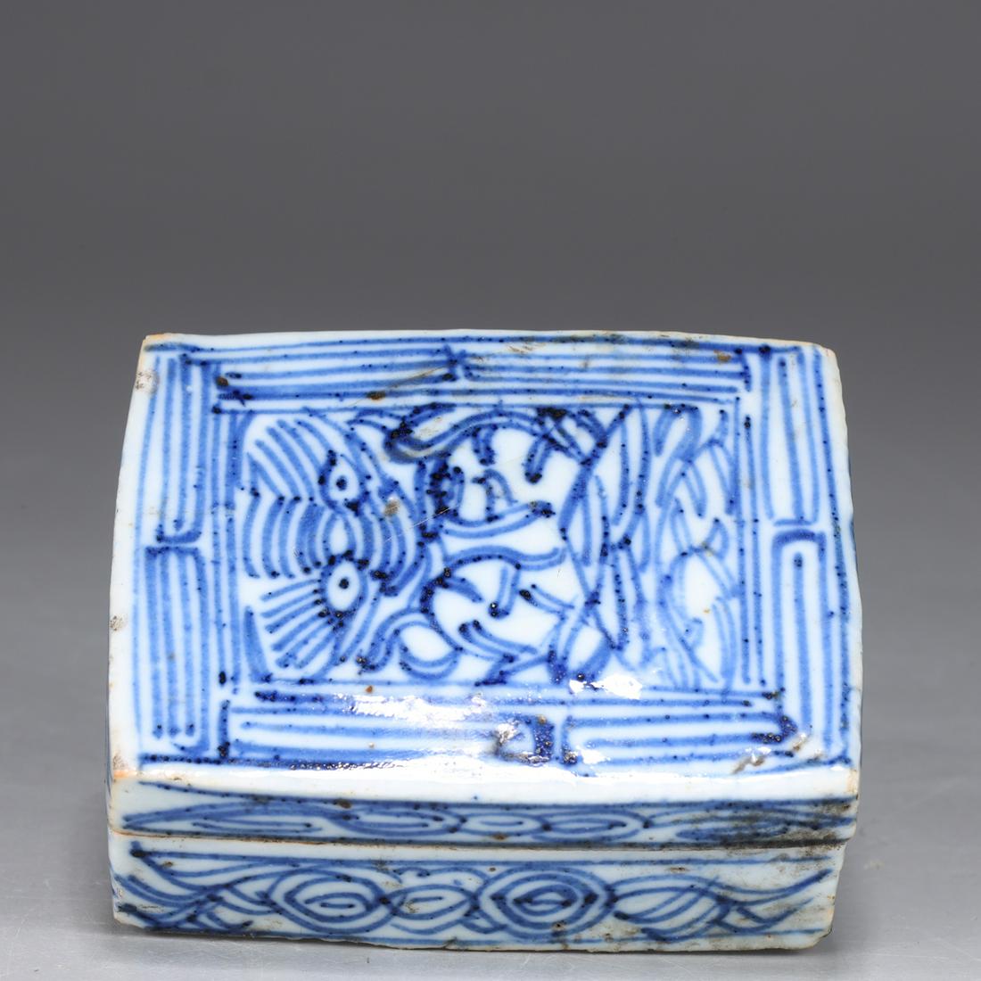 Antique Chinese Blue & White Porcelain Rectangular Box: 18th century Chinese blue and white porcelain rectangular box with a mythological creature on the lid with scrolled motif; two cracks near foot side, pitting and other flaws consistent with age; H 1 1