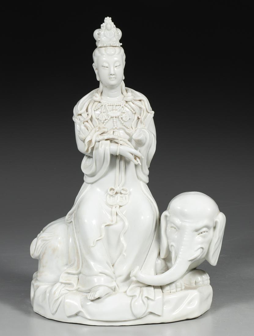 Chinese Blanc De Chine Porcelain Guanyin: Chinese blanc de s chine porcelain figure of Guanyin seated atop elephant, Guanyin holding an elaborate lotus leaf, dressed in flowing robes and jewelry; one hand and arm broken and missing, other fla