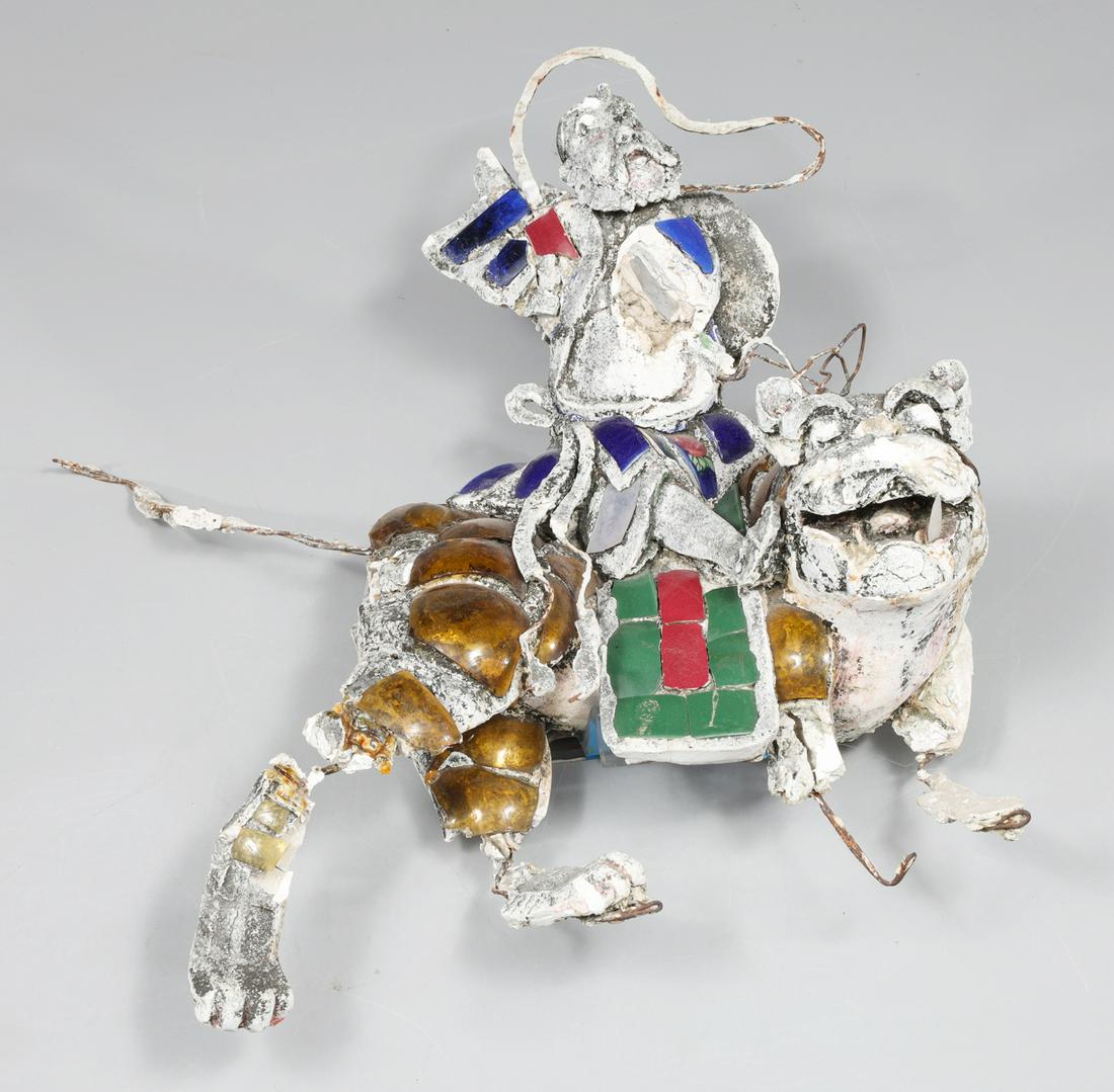 Unusual Chinese Style Outsider Art Rooftile: Unusual Chinese style outsider art rooftile, in plaster or stucco, figure riding atop a lion with polychrome appliques, mounted with lucite french cleat; as is condition, numerous areas of loss, vario