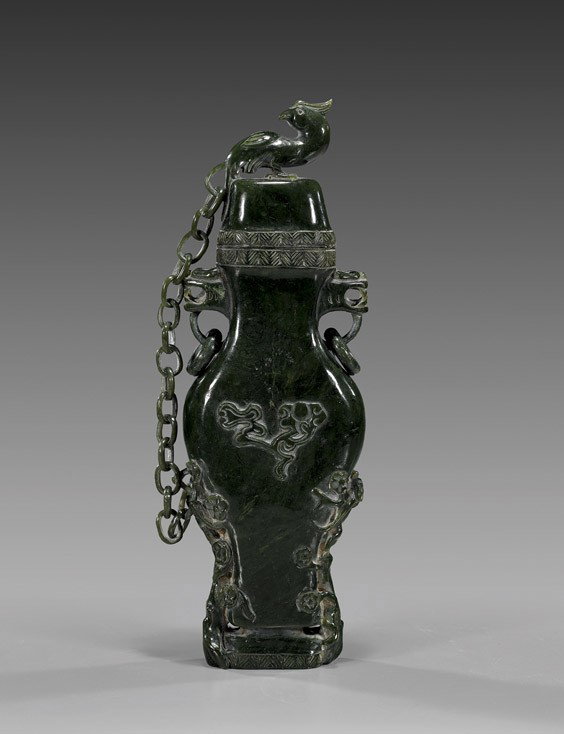 Tall Chinese Carved Spinach Jade Urn: Tall Chinese Carved Spinach Jade Urn Tall Chinese carved spinach jade urn and cover; with high relief florals the the body and two lion head loose ring handles, bird finial; the cover and body attache