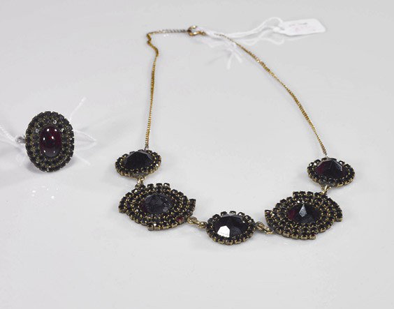 Garnet Necklace and Ring: Garnet & 14K Necklace and Silver Ring 14K yellow gold choker necklace, set with numerous large faceted garnets encircled by smaller garnets, L: 16"; together with a similar silver mounted ring set wit