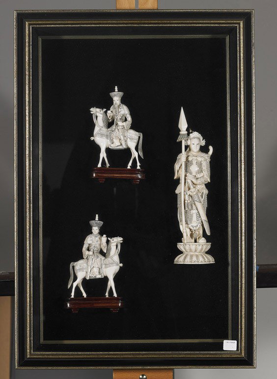 Three Chinese Carved Ivories (Framed): Three Chinese Carved Ivories (Framed) Chinese group of 3 ivories in a shadow box frame: very elaborately carved warrior standing in full armour and carrying a sword and spear; together with an equestr