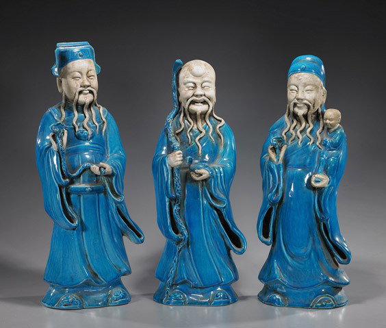 Three Chinese Glazed Porcelain Star Gods: Three Chinese Glazed Porcelain Star Gods Set of 3 Chinese blue glazed and biscuit porcelain Star Gods: wearing a cap and holding a ruyi fungus; bald and holding a staff in one hand, a bird in the othe