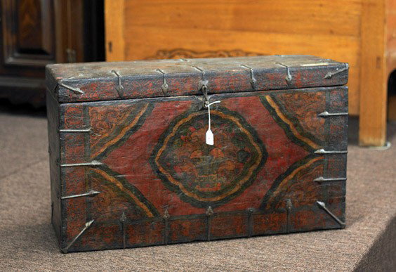 Tibetan/Mongolian Polychromed Trunk: Tibetan/Mongolian Polychromed Trunk Tibetan/Mongolian trunk with iron hardware and clasp in front; foliate design on front in red, green and yellow (wear and flaws), early 20th Century; L: 29"