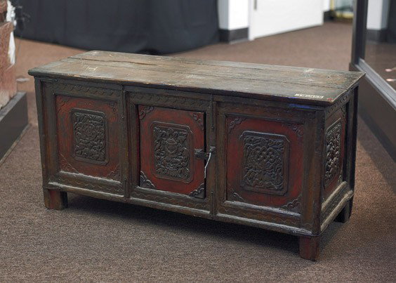 Small Tibetan/Mongolian Cabinet: Small Tibetan/Mongolian Carved Cabinet Tibetan/Mongolian cabinet with a 3-panel façade and one central hinged door: each panel with carved and polychromed foliate and Buddhist emblems (wear), early 2