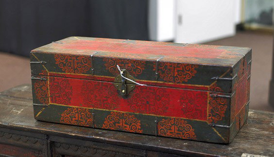 Small Tibetan/Mongolian Polychromed Trunk: Tibetan/Mongolian Polychromed Trunk Tibetan/Mongolian trunk: painted with repetitive scrolled foliate design, with metal hardware and clasp (usual wear), early 20th Century; L: 22"