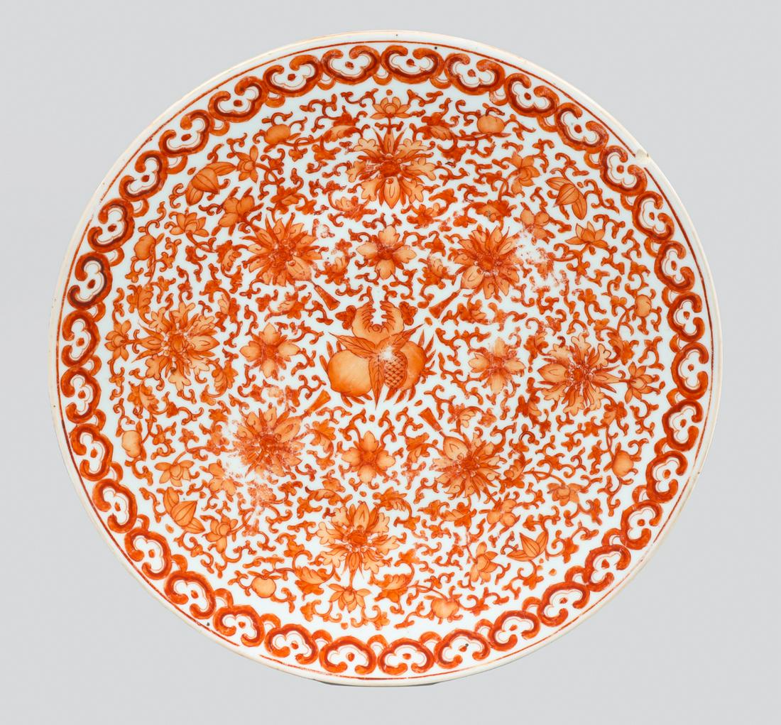 Antique Chinese Red and White Porcelain Charger: Antique, possibly mid 19th century, Chinese red and white porcelain charger with red lotus scroll detail; as-is condition- General marks and age wear, minor rim chips, scratches, rubbing, flaws, and l
