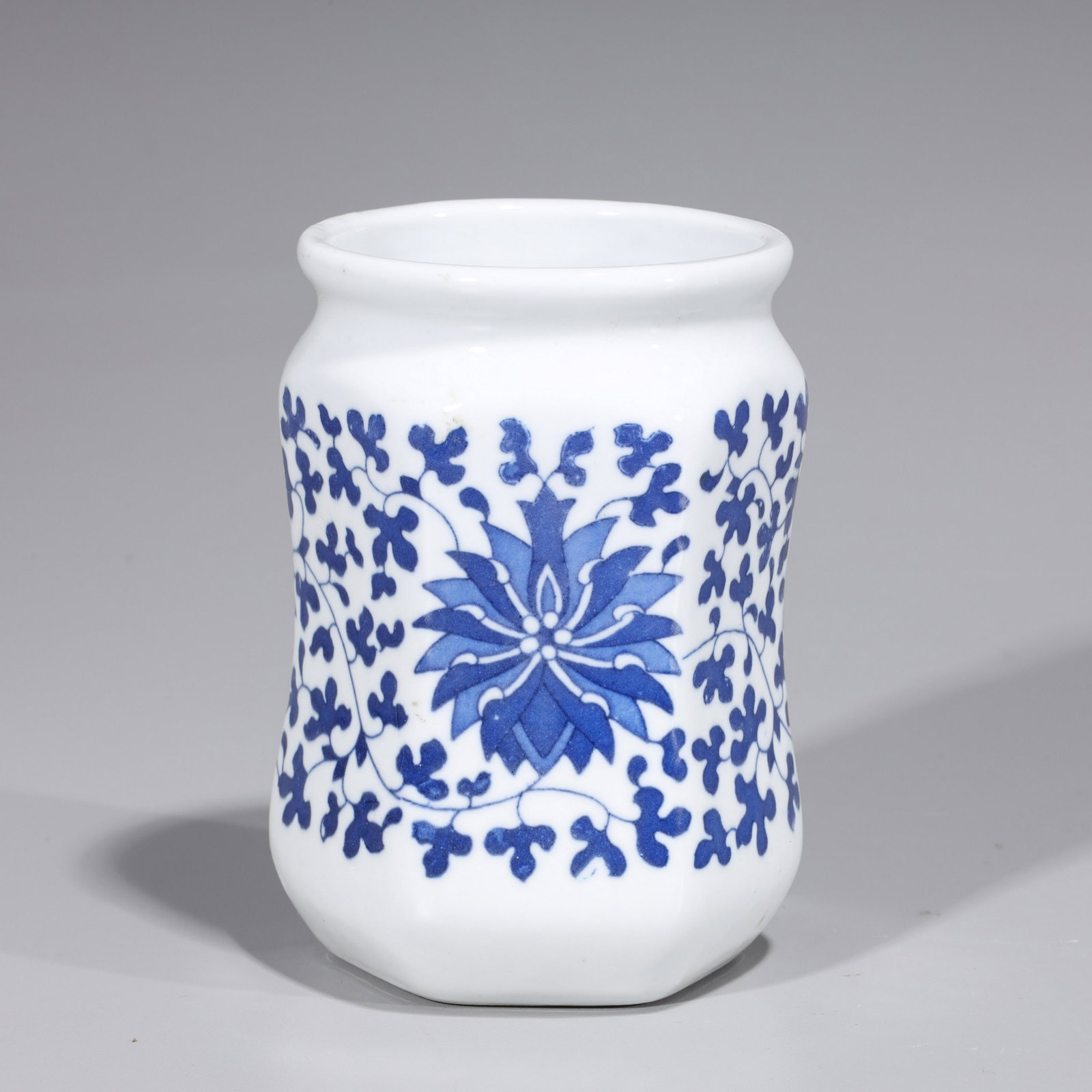Chinese Blue & White Porcelain Vase: Chinese blue and white porcelain vase with floral designs, calligraphy to body, six-character Qianlong mark to base but later; overall good condition with some surface wear and minor flaws; H 5" x D 3