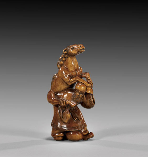 CONTEMPORARY WOOD NETSUKE: Sage & Horse: CONTEMPORARY WOOD NETSUKE: Sage & Horse Contemporary carved wood netsuke; of a bearded sage carrying a horse on his back, the horse with inlaid eyes; by Hideyuki, signed in rectangular gold plaque