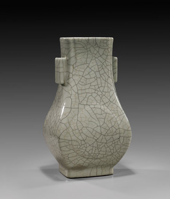 CHINESE GE-TYPE PORCELAIN CRACKLE VASE: CHINESE GE-TYPE PORCELAIN CRACKLE VASE Chinese Ge-type crackle-glazed porcelain vase; of hu-form, the squared baluster form with a moulded peach to the body on either side, with squared tubular handle