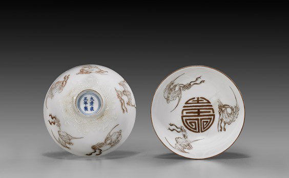 PAIR ANTIQUE SEPIA PORCELAIN BOWLS: PAIR ANTIQUE SEPIA PORCELAIN BOWLS Pair of antique, delicate Chinese porcelain bowls: each interior with design of three sepia bats flanking a Shou medallion at center; the exteriors with sepia bats a