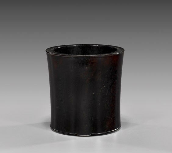 ANTIQUE CHINESE HARDWOOD BRUSHPOT: ANTIQUE CHINESE HARDWOOD BRUSHPOTAntique Chinese hardwood tripod brushpot; of slightly tapered cylindrical form, showing fine grain patterning and of fine patina; H: 5 1/2"