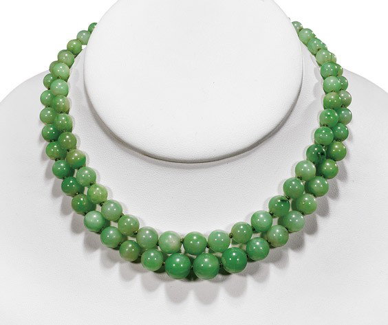 JADEITE DOUBLE STRAND BEAD NECKLACE: JADEITE DOUBLE STRAND BEAD NECKLACE Early 20th Century, Chinese jadeite double-strand bead choker necklace; the graduated beads of attractive translucent apple green with some darker green suffusions;