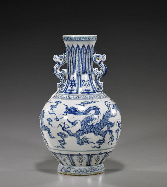 Chinese Blue & White Porcelain Dragon Vase: Chinese Blue & White Porcelain Dragon Vase Chinese Yuan-style blue and white porcelain dragon vase; bottle form with dragon handles and design of writhing dragons among clouds to the body, Buddhist em