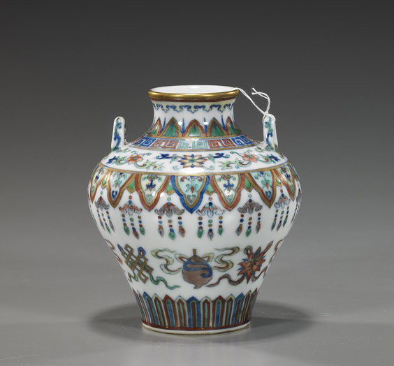 Small Chinese Doucai Porcelain Vase: Small Chinese Doucai Porcelain Vase Charming, small Chinese Qianlong-style doucai porcelain vase; of squat, high shouldered form with two loop handles and with Buddhist symbol designs; H: 5"
