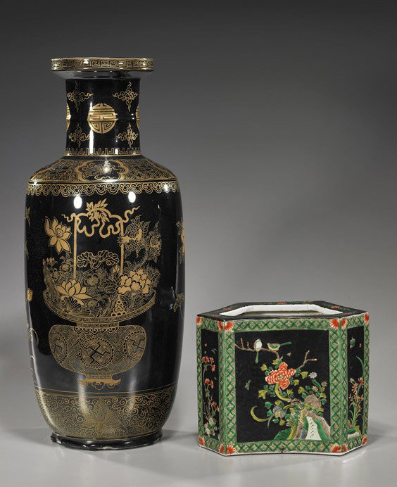 Two Chinese Black-Ground Porcelains: Two Chinese Black-Ground Porcelains Two Chinese Kangxi-style porcelains: mirror black rouleau vase with gilt floral arrangements and various other Buddhist motifs, 6- character mark; and a Famille Noi