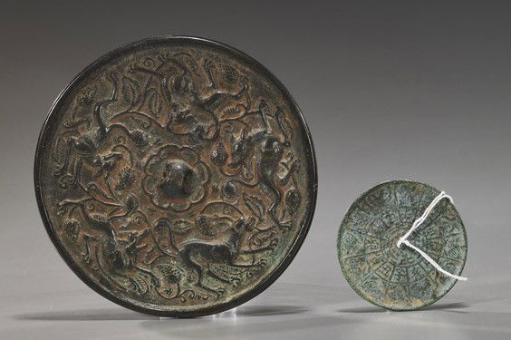 Two Antique Chinese Bronze Mirrors: Two Antique Chinese Bronze MirrorsTwo antique Chinese bronze mirrors: larger with gamboling qilin among grape vines; smaller with zodiac pattern; both probably Yuan/Ming Dynasty; D: 5 1/4" (larger)