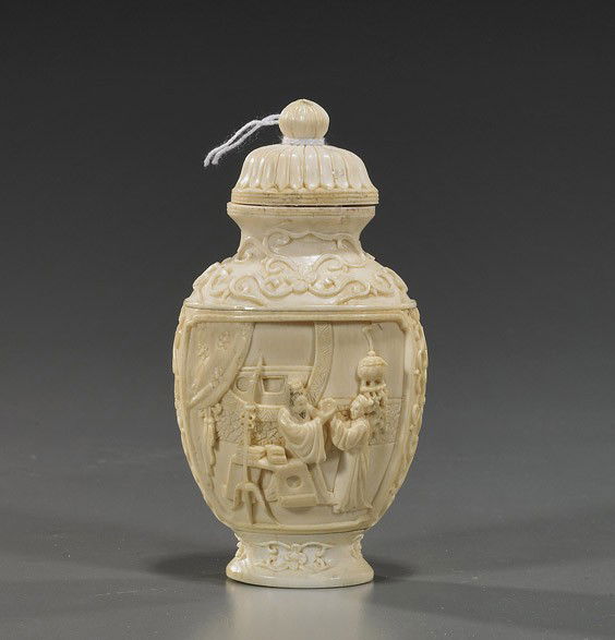 Chinese Carved Ivory Snuff Bottle: Chinese Carved Ivory Snuff BottleChinese carved sectional ivory footed snuff bottle; with panel relief scenes of figures in interiors, on floral ground, matching stopper; H: 4 1/2"