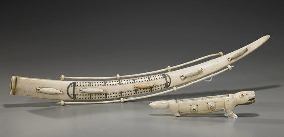 Two Eskimo Carved Ivory Cribbage Boards: Two Eskimo Carved Ivory Cribbage Boards Two Eskimo carved walrus ivory cribbage boards: long tusk with ivory rails and seals with inlaid eyes (no pegs); together with an unusual older animal form with