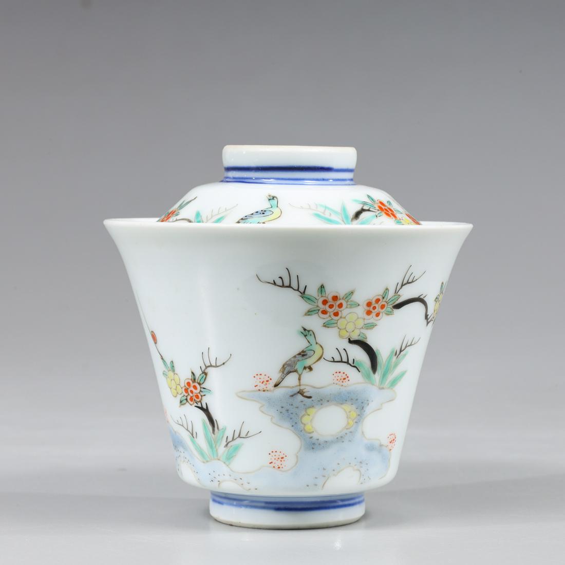 Chinese Qing Dynasty Enameled Porcelain Wine Cup: Chinese late Qing Dynasty thickly enameled porcelain wine cup of flared fluted form depicting bird atop rockery with flowers; L 3 1/2" x H 3 1/2" (Approx.)
