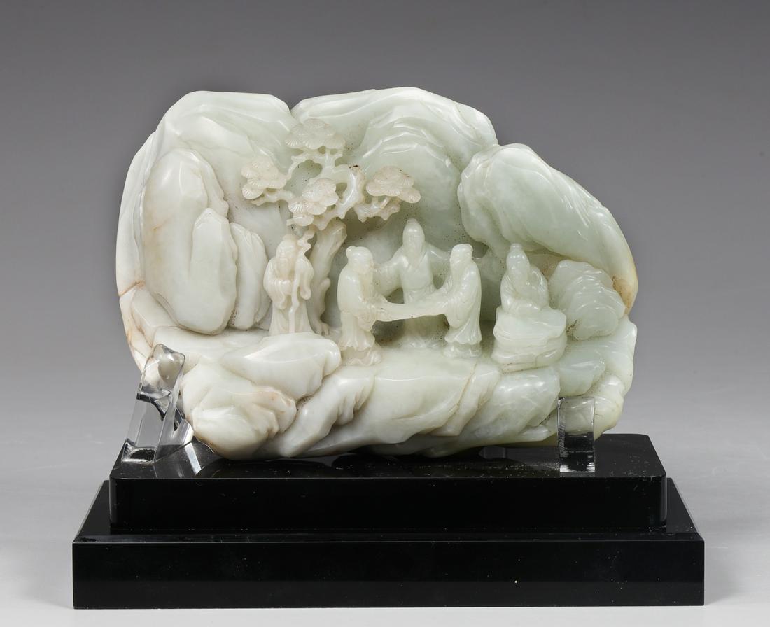 Large Chinese Carved Jade Mountain: Large antique Chinese finely carved river boulder, the nephrite jade of mutton fat coloration, some becoming white depicting a group of scholars, three examining an unrolled scroll, one seated in deep
