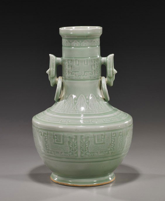 Chinese Celadon Glazed Porcelain Vase: Chinese Celadon Glazed Porcelain Vase18th Century-style, Chinese celadon glazed porcelain vase; somewhat bottle form with two ring handles and with carved archaistic bird-type designs, seal mark; H: 1