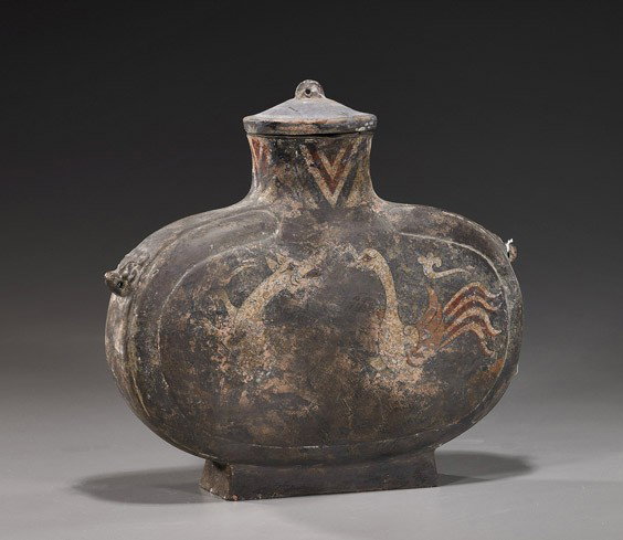 Chinese Han Dynasty Painted Pottery Flask: Chinese Han Dynasty Painted Pottery Flask Chinese Han Dynasty painted pottery flask; of flattened ovoid form with cover and moulded mask handles some slip decoration of dragon and phoenix remaining (o