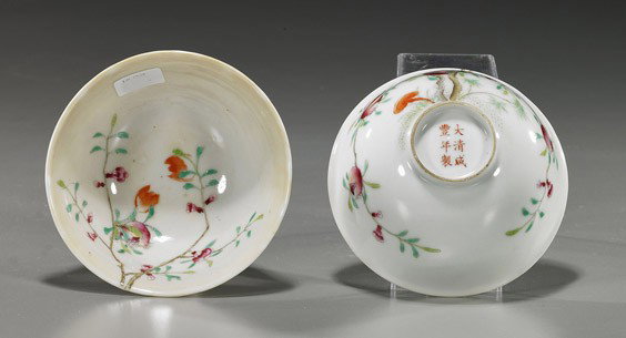 Pair Famille Rose Porcelain Tea Bowls: Pair Famille Rose Porcelain Tea Bowls Pair charming Chinese Famille Rose porcelain tea bowls; each with designs extending from exterior to interior depicting pomegranates on branches with bats and ruy