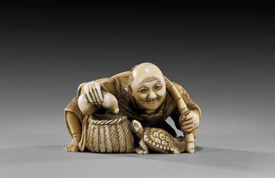 Antique Ivory Netsuke: Fisherman: Antique Ivory Netsuke: Fisherman Antique carved ivory netsuke: of a seated fisherman with bamboo fishing pole; holding a gourd above a minogame and basket, signed Hidemasa (?), late 19th Century (some