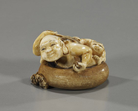 Carved Ivory Netsuke: Figure in a Tub: Carved Ivory Netsuke: Figure in a Tub Elaborately carved ivory netsuke; of a figure in a tub scrubbing his back and with a child/gargoyle washing his back, signed