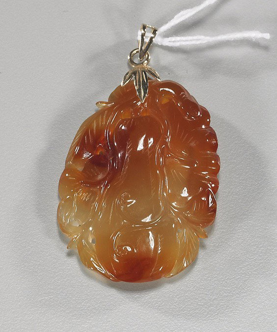 Chinese Carved Carnelian Pendant: Chinese Carved Carnelian Pendant Nearly transparent, Chinese carved carnelian agate pendant; of a squash and blossoms on a vine, with 14K yellow gold mounts L: 2"