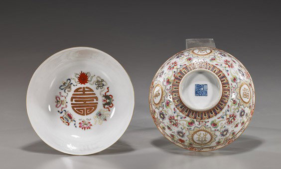 Pair Chinese Famille Rose Porcelain Bowls: Pair Chinese Famille Rose Porcelain Bowls Pair Chinese Qianlong-style Famille Rose porcelain bowls; each with Buddhist floral designs and character reserves to the exterior, interiors with Buddhist em